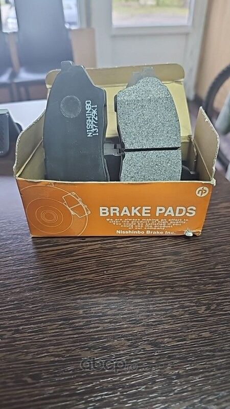 Колодки тормозные передние (Nisshinbo). Артикул PF1434