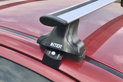 Багажник INTER Spectr на гладкую крышу для Chevrolet Aveo II седан 2011-2015 (Крыловидные дуги, с Замком). Артикул 5525-A-8803-1205