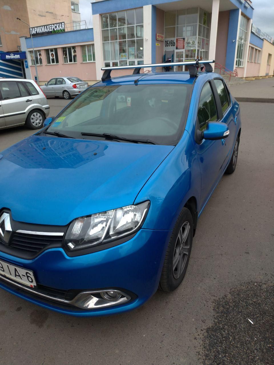 Багажник на крышу Атлант на штатные места для Renault Logan II седан 2014-2026 (Аэродинамические дуги). Артикул 7632