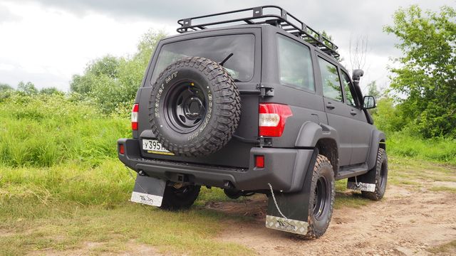 Бампер задний силовой “М” АВС-Дизайн для УАЗ Patriot 2005-2014 с лифтом положения кузова 0-65 мм. С квадратом под фаркоп, под покраску. Артикул ABC.UAZ.RB.28M