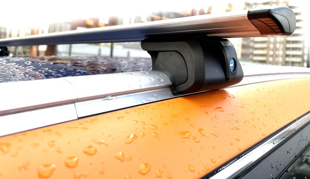 Багажник на рейлинги INTER Titan i-Pro (с замком) для Geely Coolray 2020-2026 (Крыловидные дуги). Артикул 5527-1206