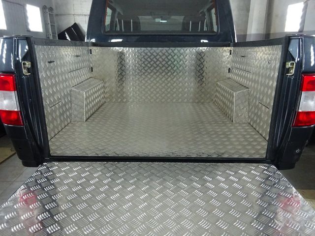 Обшивка АВС-Дизайн для грузового кузова с карманами УАЗ Пикап 2015-2025. Рифленый алюминий 2мм, неокрашенный. Артикул ABC.UAZ.BP.0001